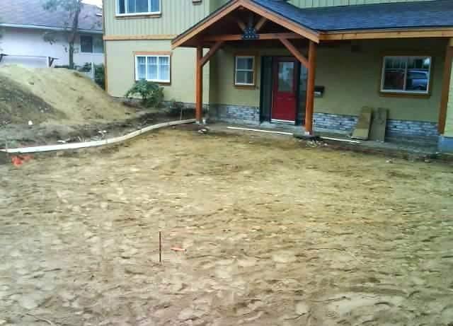 Excavated and graded base prep before pouring a concrete driveway in Colwood, BC