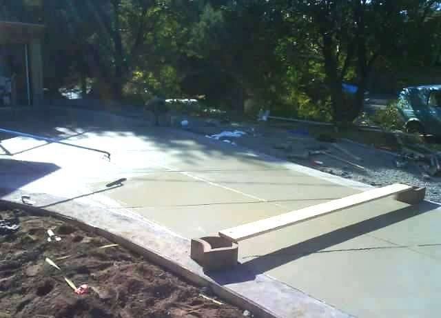 Finished concrete driveway with stamped border band and diagonal contraction joints in Colwood, BC