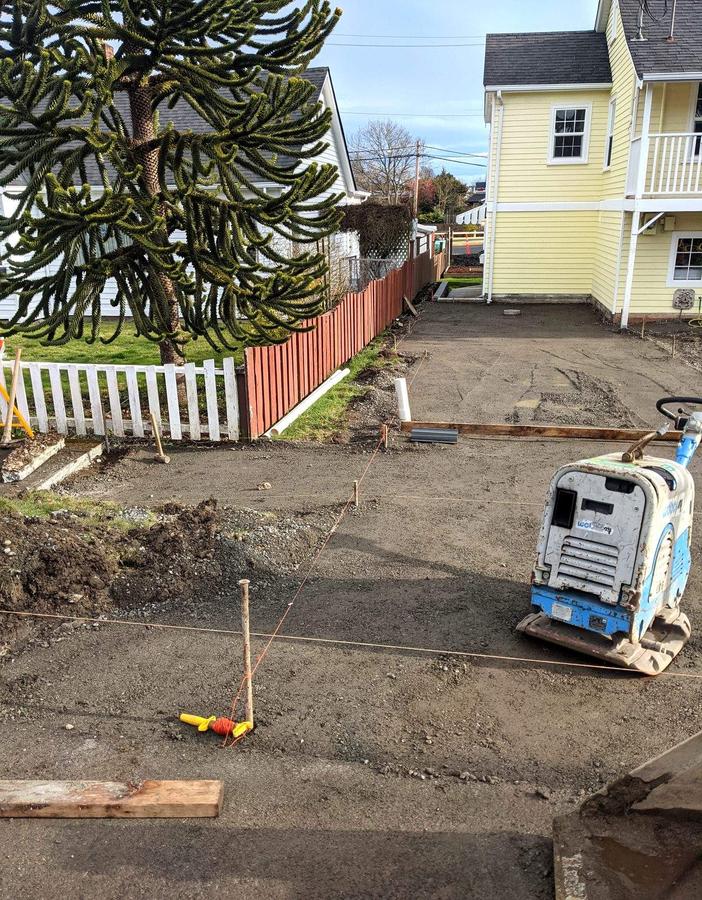 Compacting and forming the gravel base before a concrete pour in Esquimalt, BC