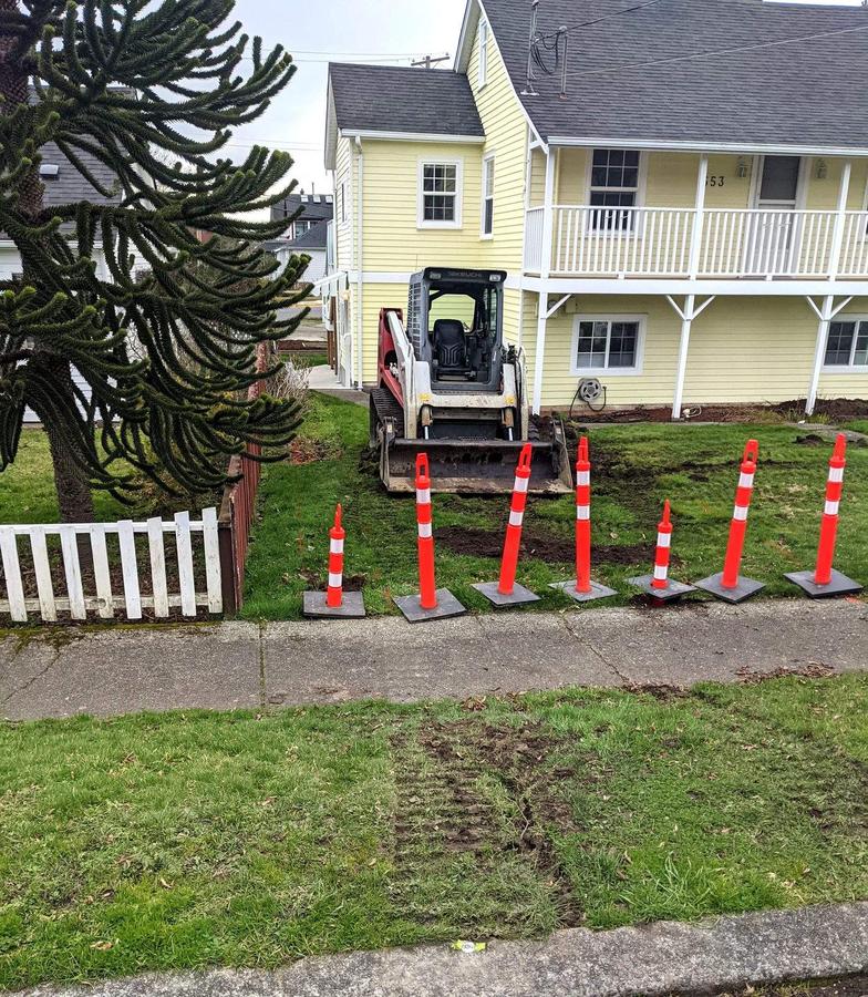 Takeuchi skid steer excavating a boulevard for a new driveway and sidewalk in Esquimalt, BC