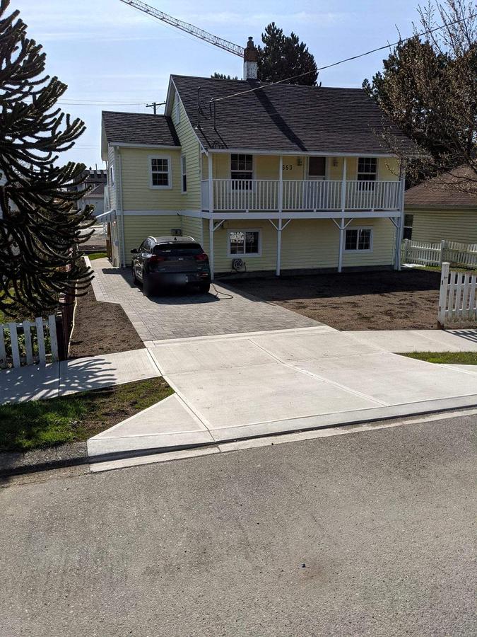 Completed concrete driveway approach and sidewalk panels in Esquimalt, BC