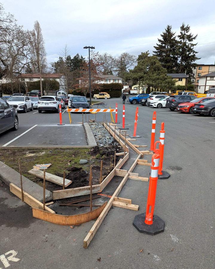 Wood and steel forms set for a hand-formed concrete curb island in Langford, BC